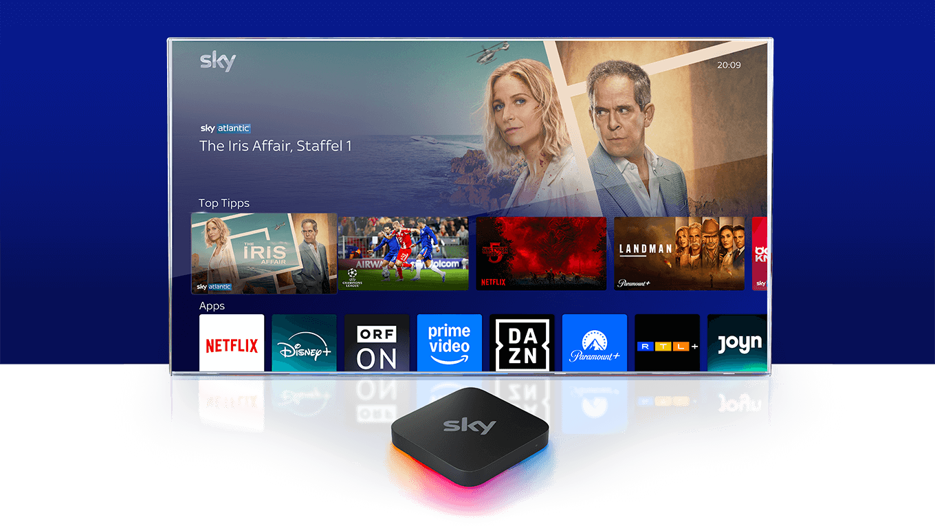 Sky Stream Box vor einem Fernseher, auf dem das Sky Stream UI zu sehen ist.