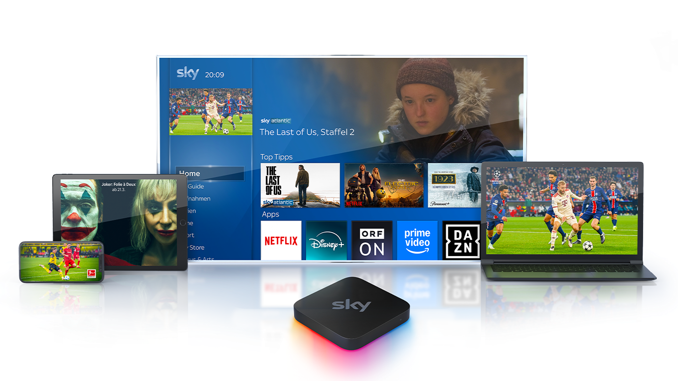 Ein Sky Stream Box vor einem Fernseher mit der Sky Stream UI sowie verschiedenen mobilen Geräten mit, die jeweils einen bei Sky erhältlichen Inhalt abbilden.